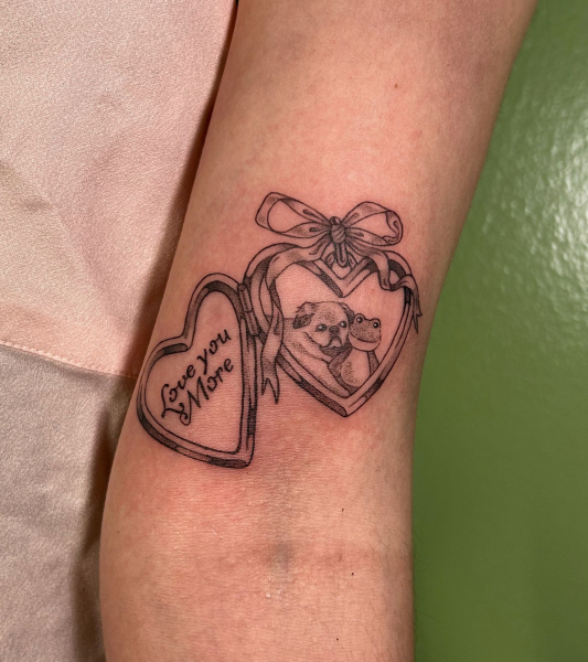 cute locket tattoo with dog and favorite toy